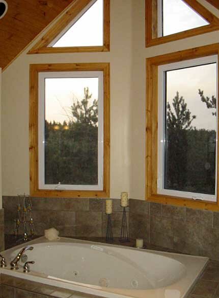 Detail image of the Model C-510 Chalet Master Bath showing the jetted tub and view windows.